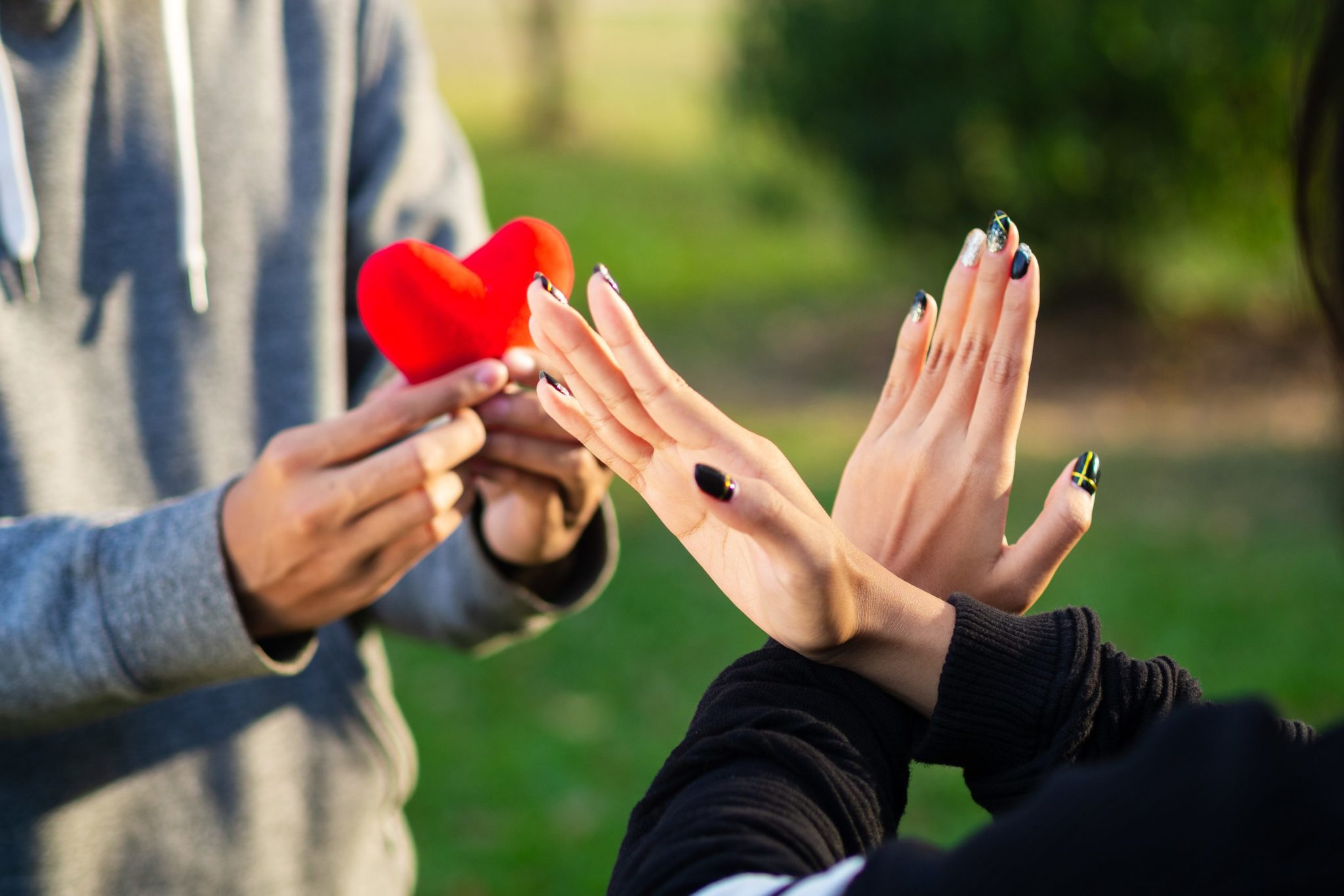 woman-refusing-red-heart-form-the-man-broken-heart-love